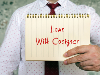 Image of a loan agreement with a cosigner's signature highlighted, symbolizing shared financial responsibility. 